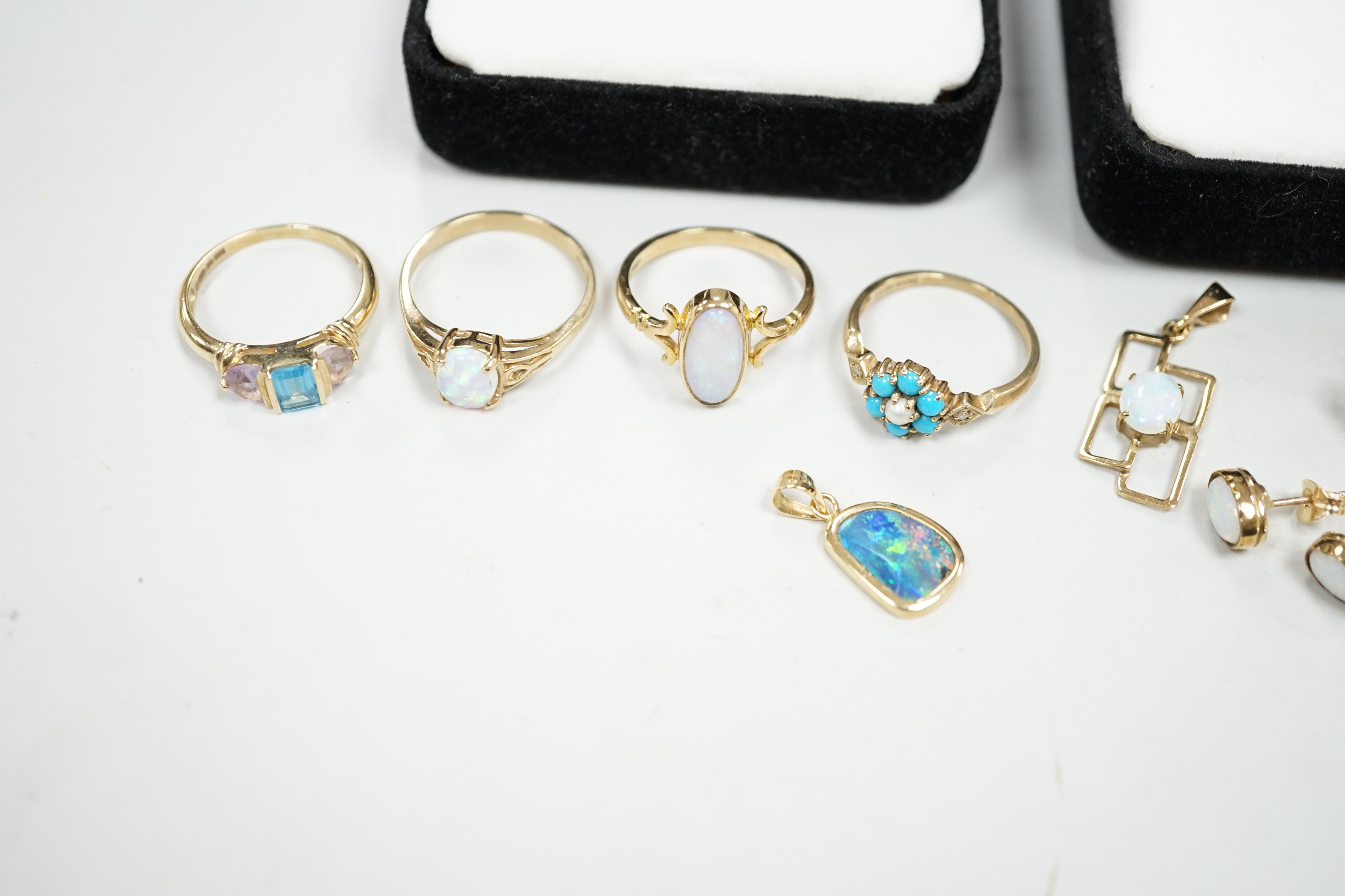 Four assorted modern 9ct gold and gem set rings including two white opal, gross weight 9.4 grams, two pairs of modern 9ct gold and gem set ear studs and other minor jewellery.